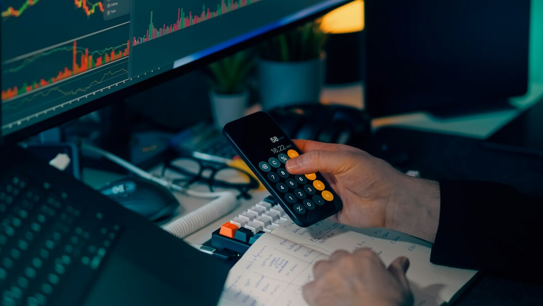 person using financial calculator