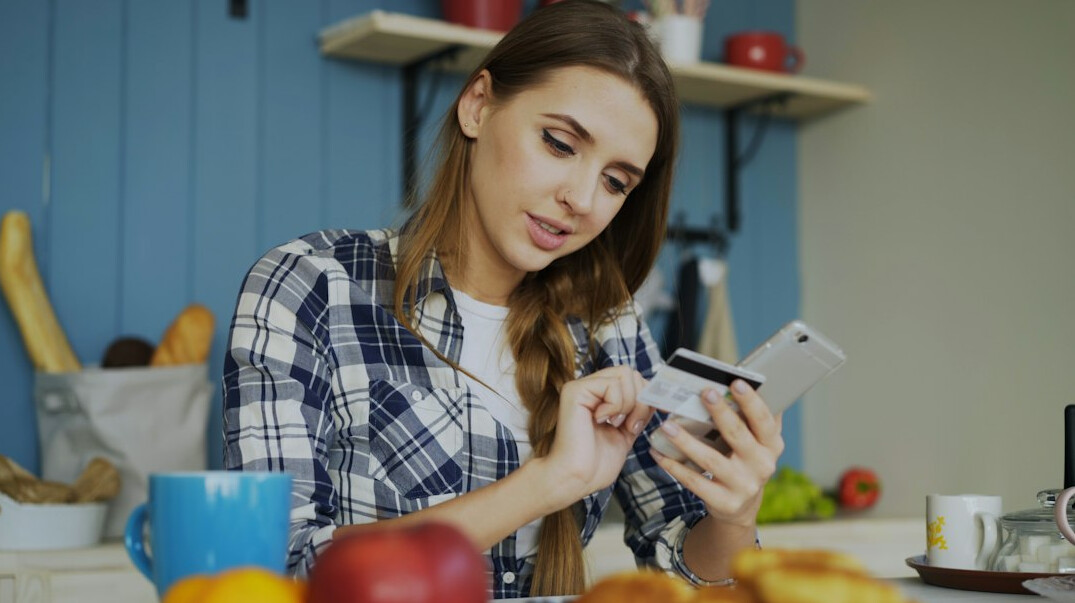 woman calculating expenses at home